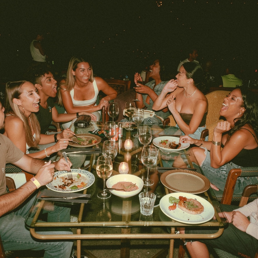 Table of guests connecting at a Thrive dinner social