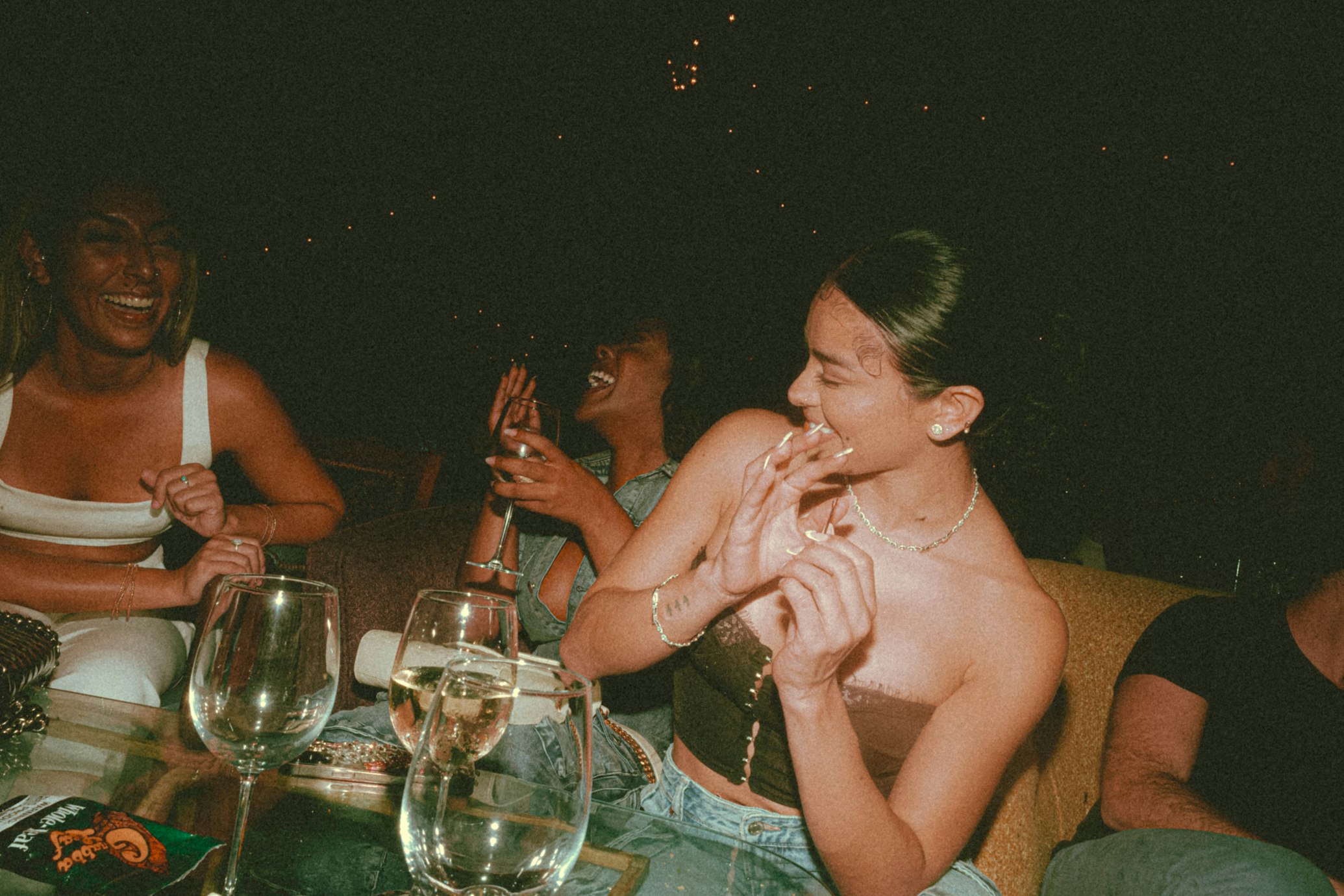 Guests laughing at a Thrive dinner social
